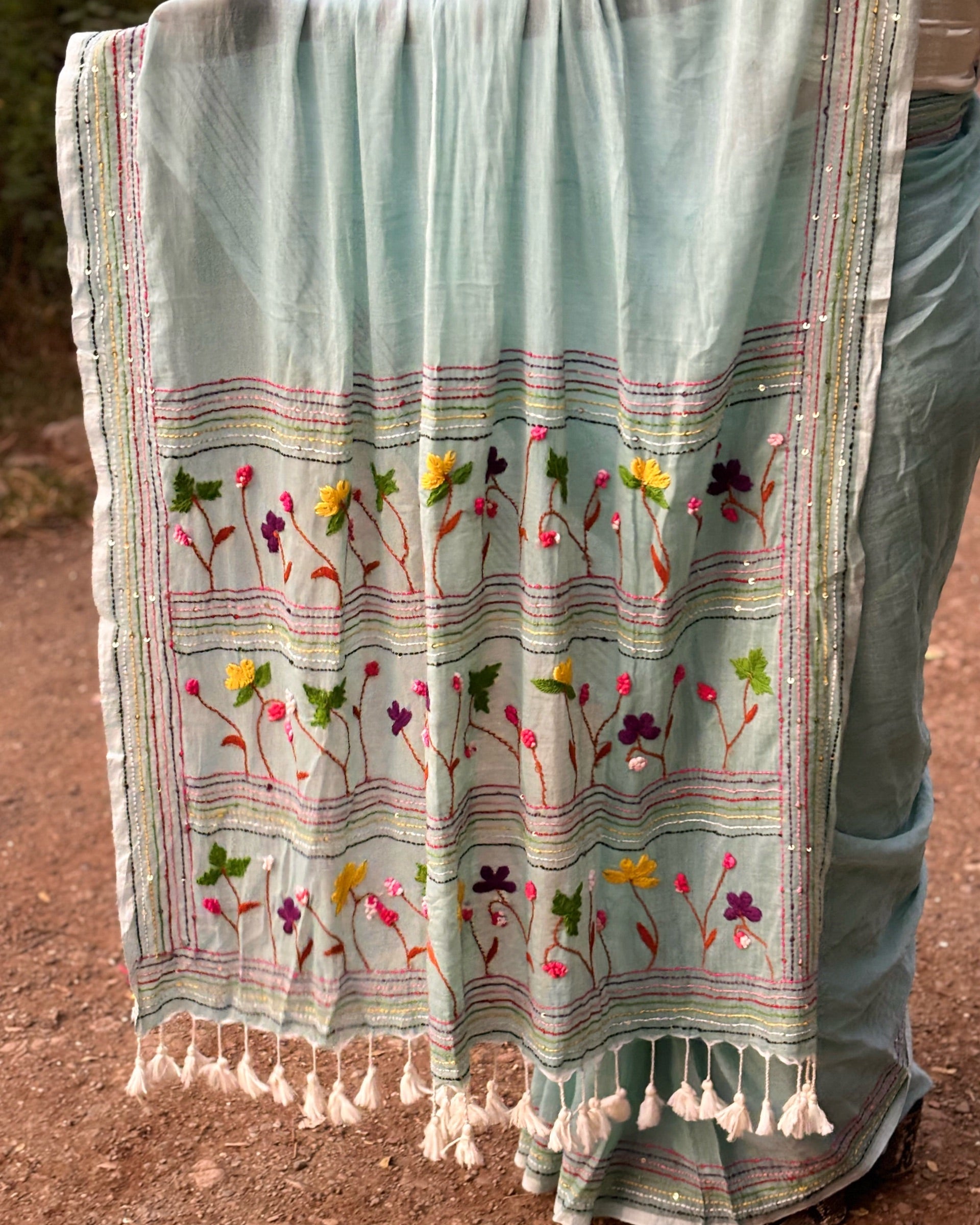 Soft mulmul cotton saree in cyan color featuring elegant embroidery