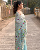mulmul cotton saree in cyan with intricate embroidered patterns