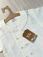 Oslo organic cotton-linen kids shirt close-up of fabric weave and natural corozo buttons