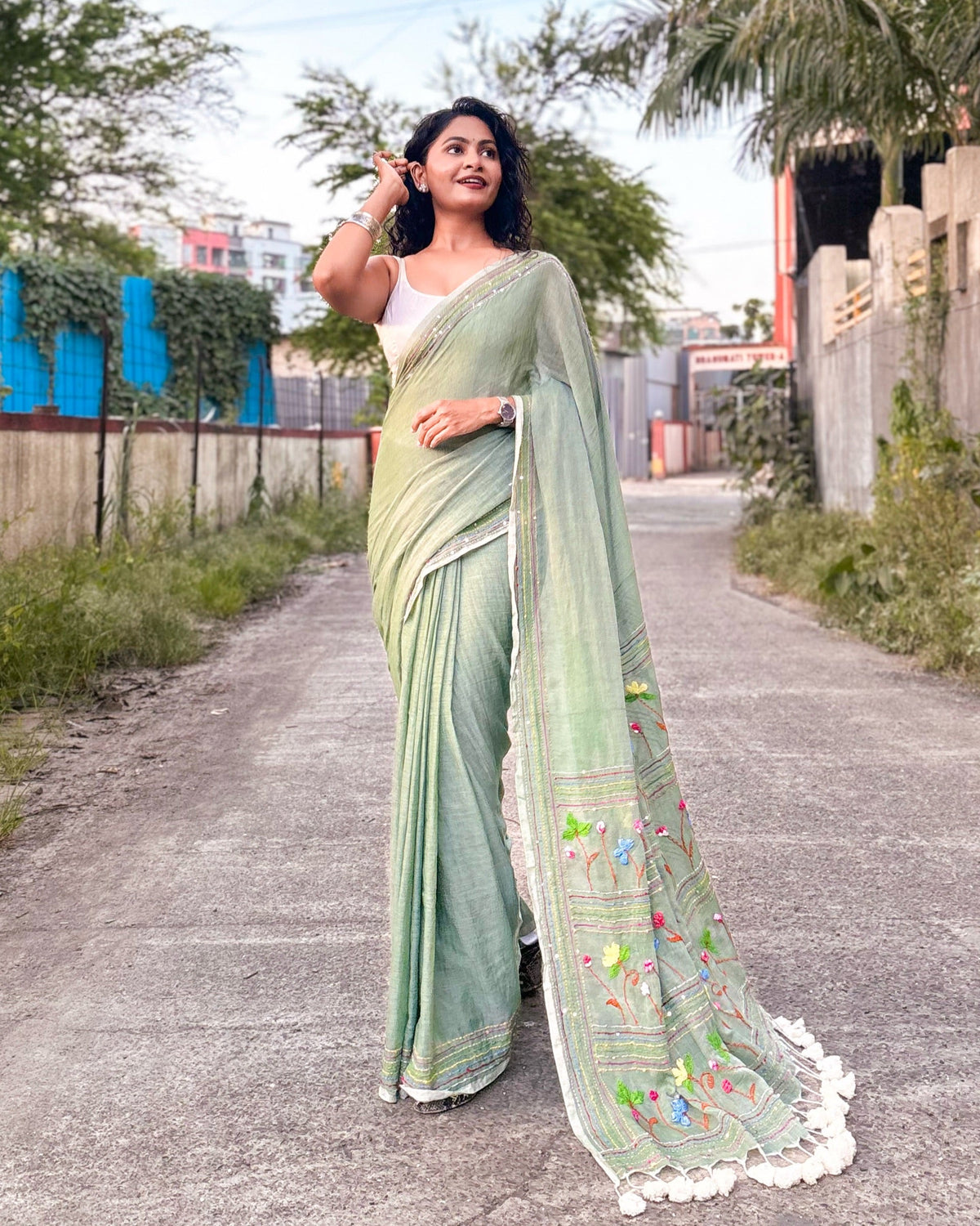 Elegant green mulmul saree with delicate embroidery soft cotton fabric
