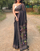 Elegant drape of Noir Petal Nocturne black mulmul saree with floral embroidery