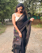 Noir Petal Nocturne black embroidered mulmul saree with elegant handcrafted detailing