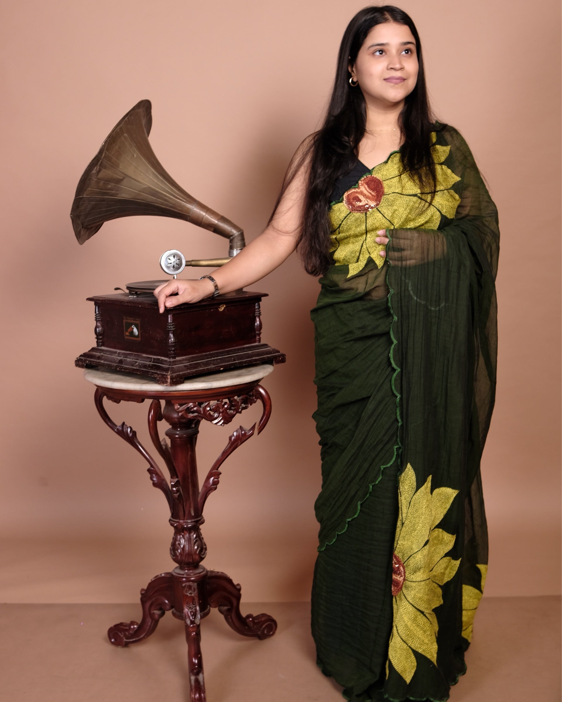 Bloom in the Wild green cotton saree, handcrafted with refined embroidery for a breathable and graceful look.
