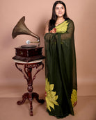 Bloom in the Wild green embroidered mulmul cotton saree, a lightweight breathable saree for summer styling and festive wear.