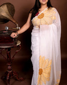 White mulmul cotton saree with sunflower embroidery, soft airy elegance for summer styling and festive moments.