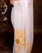 Sunshine Bloom white cotton saree, handcrafted with sunflower embroidery for a breathable and graceful summer look.