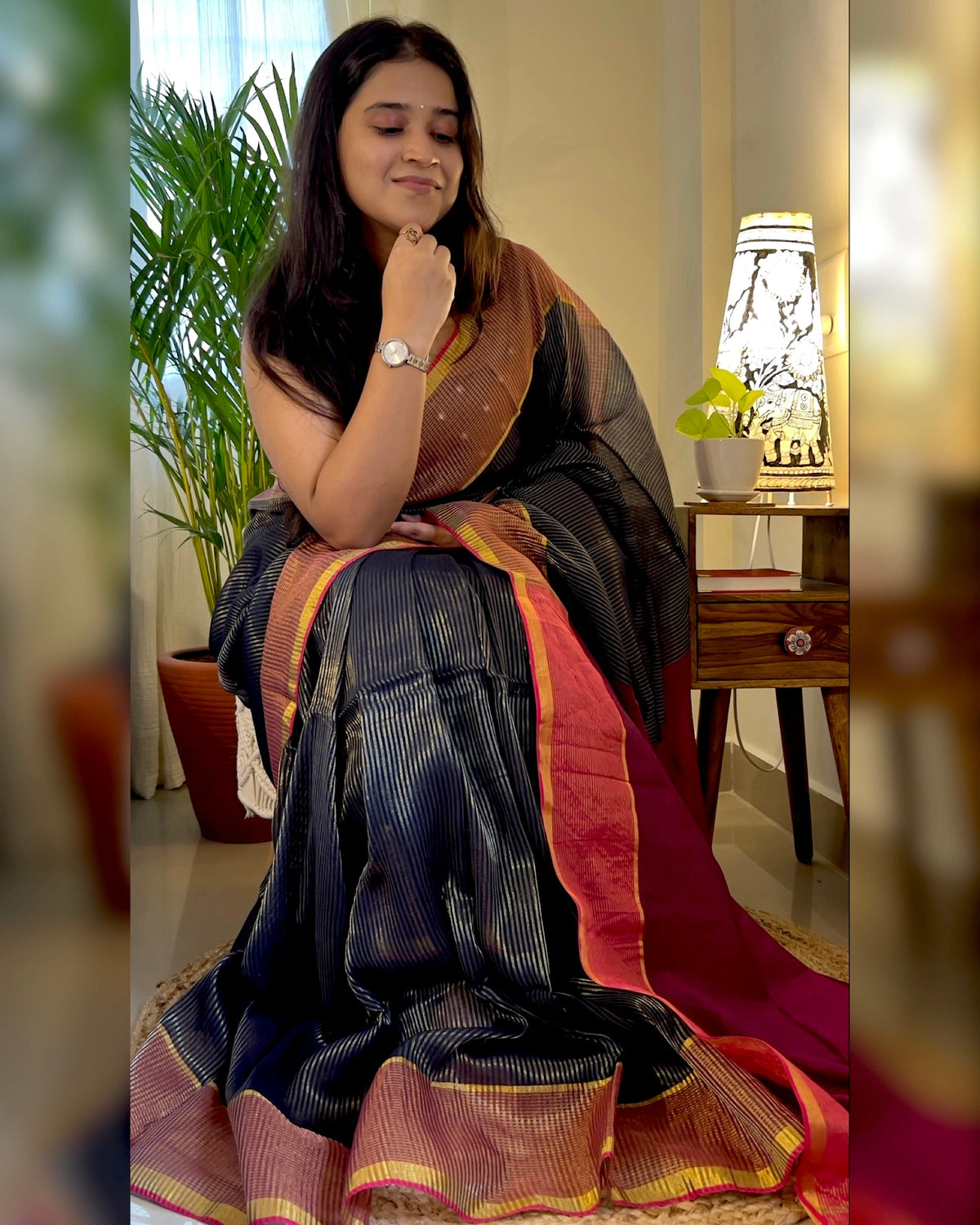 Designer black cotton handloom saree with elegant zari accents for celebrations