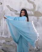 Soft and Comfortable mulmul cotton saree in sky blue shade with sequin emblishment for festive or party wear at reasonable price