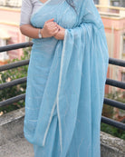 Soft and Comfortable mulmul cotton saree in sky blue shade with sequin emblishment for festive or party wear at reasonable price