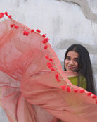 Soft and Comfortable mulmul cotton saree in dual tone peach and green shade with sequin emblishment for festive or party wear at reasonable price
