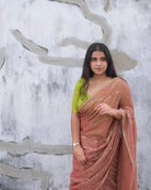 Soft and Comfortable mulmul cotton saree in dual tone peach and green shade with sequin emblishment for festive or party wear at reasonable price