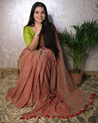 Soft and Comfortable mulmul cotton saree in dual tone peach and green shade with sequin emblishment for festive or party wear at reasonable price