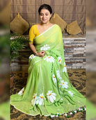 Soft and comfortable light weight light green mulmul cotton saree with floral hand painting good for day time wear