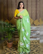 Soft and comfortable light weight light green mulmul cotton saree with floral hand painting good for day time wear