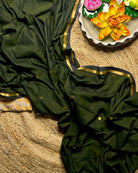 Soft and Comfortable mulmul cotton saree in green shade with golden sequin emblishment for festive or party wear at reasonable price