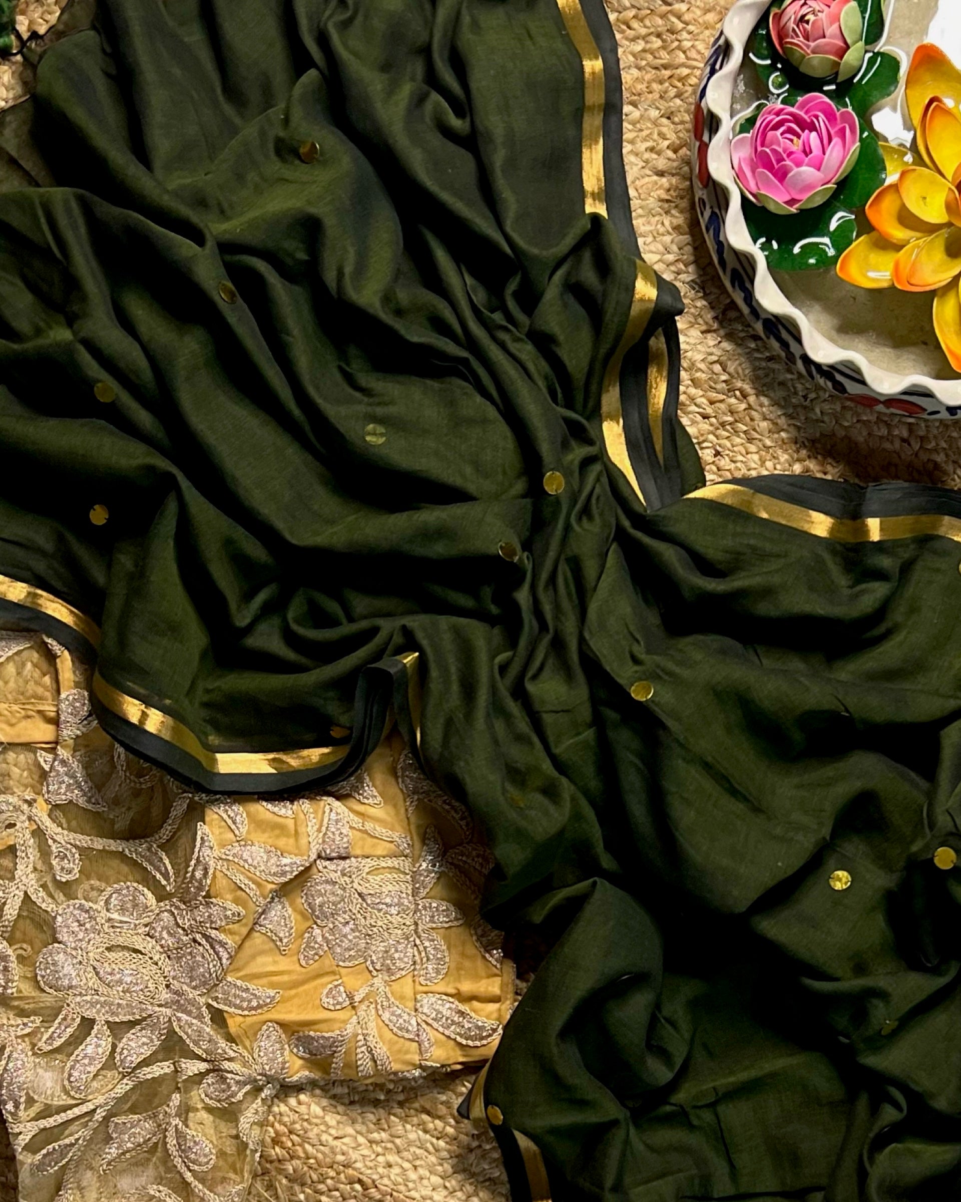 Soft and Comfortable mulmul cotton saree in green shade with golden sequin emblishment for festive or party wear at reasonable price