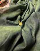 Soft and Comfortable mulmul cotton saree in green shade with golden sequin emblishment for festive or party wear at reasonable price