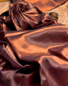 Viral Comfortable tissue saree in metallic golden and copper tones for festive or party wear at reasonable price