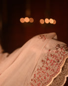 Lightweight brown taupe zari embroidered mulmul cotton saree, designed for festive wear with soft airy comfort.