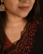 Rasika black mulmul cotton saree with delicate zari embroidery, a breathable summer saree with a subtle festive touch.