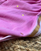 Soft and Comfortable mulmul cotton saree in powder pink shade with sequin emblishment for festive or party wear at reasonable price