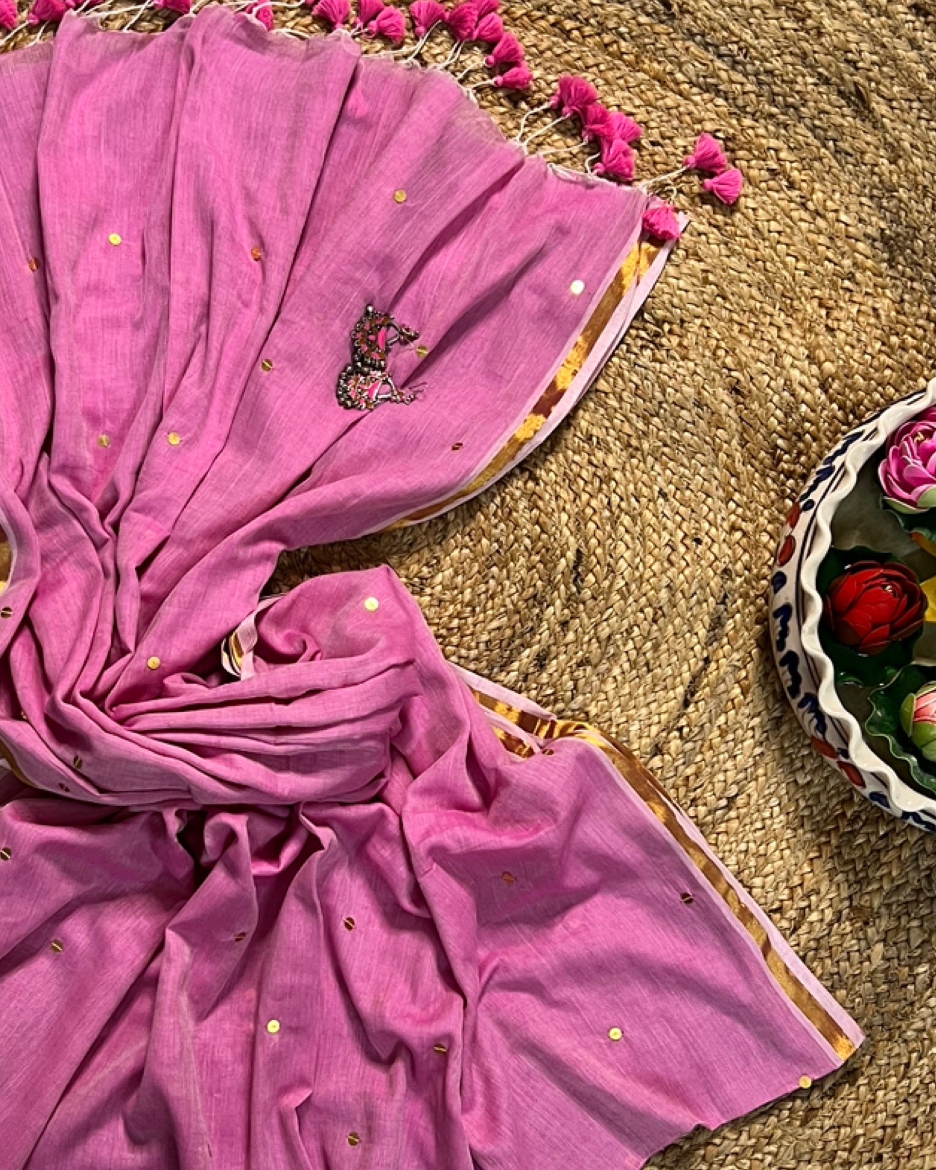 Soft and Comfortable mulmul cotton saree in powder pink shade with sequin emblishment for festive or party wear at reasonable price