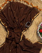 Soft and Comfortable mulmul cotton saree in chocolate caramel brown shade with sequin emblishment for festive or party wear at reasonable price