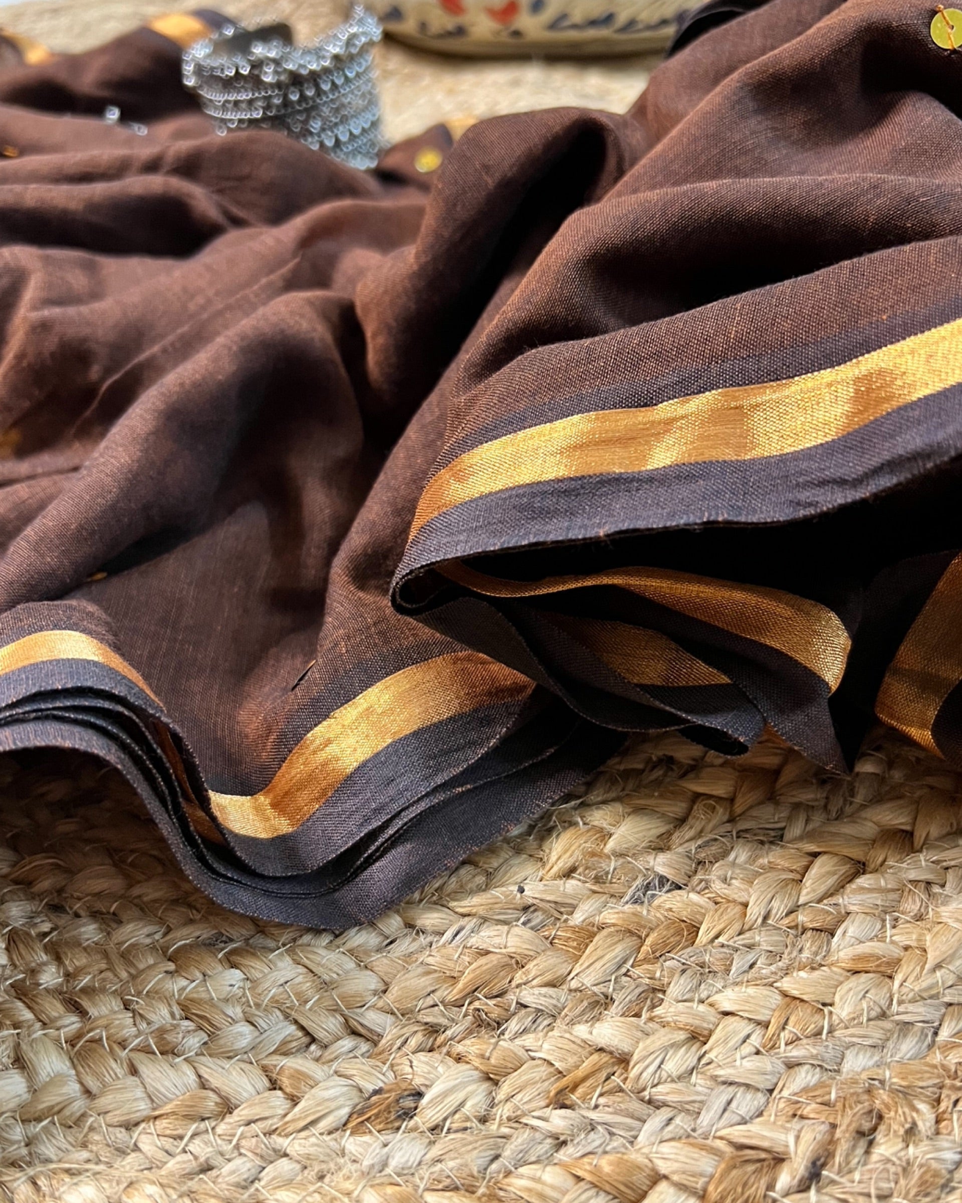 Soft and Comfortable mulmul cotton saree in chocolate caramel brown shade with sequin emblishment for festive or party wear at reasonable price