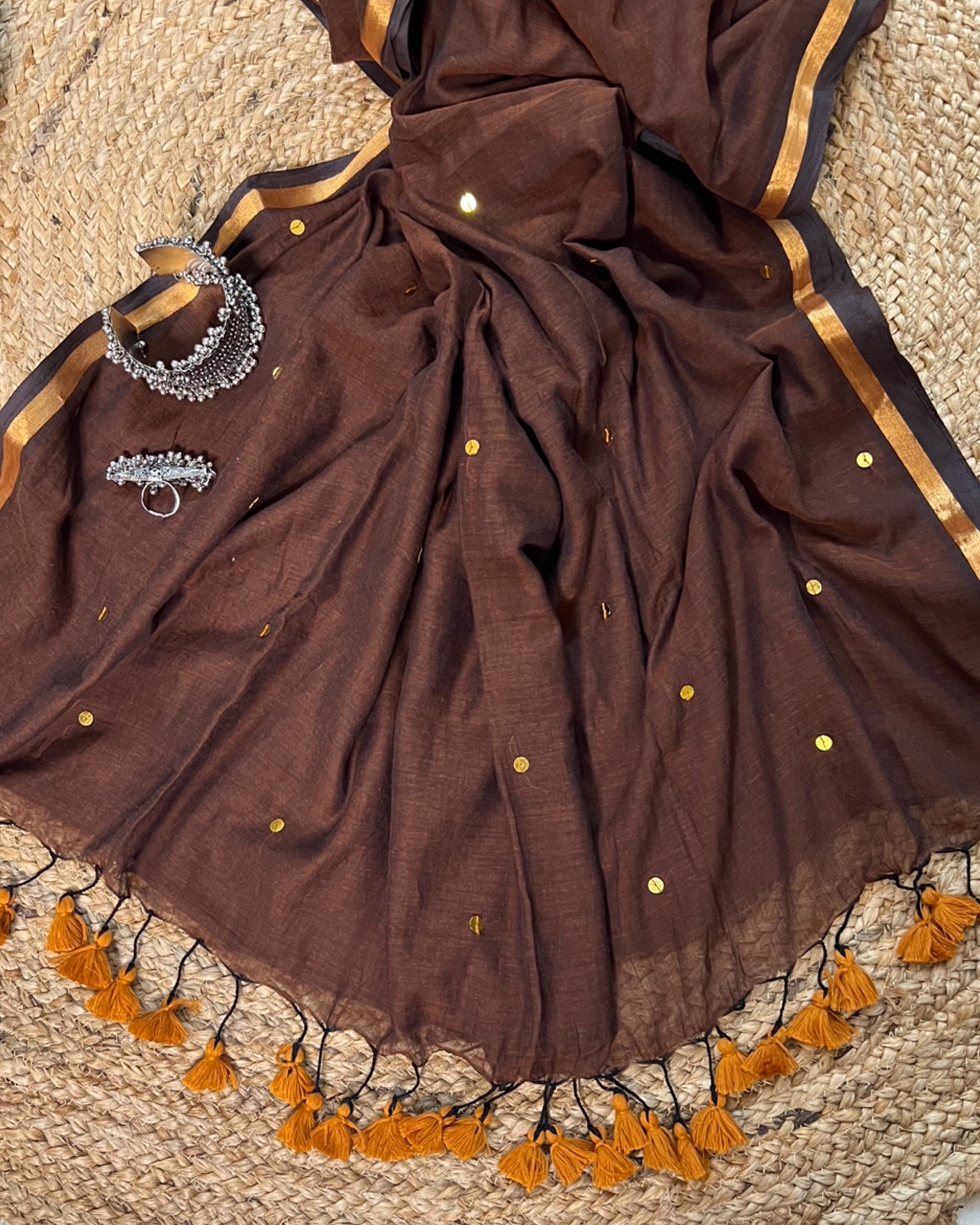 Soft and Comfortable mulmul cotton saree in chocolate caramel brown shade with sequin emblishment for festive or party wear at reasonable price