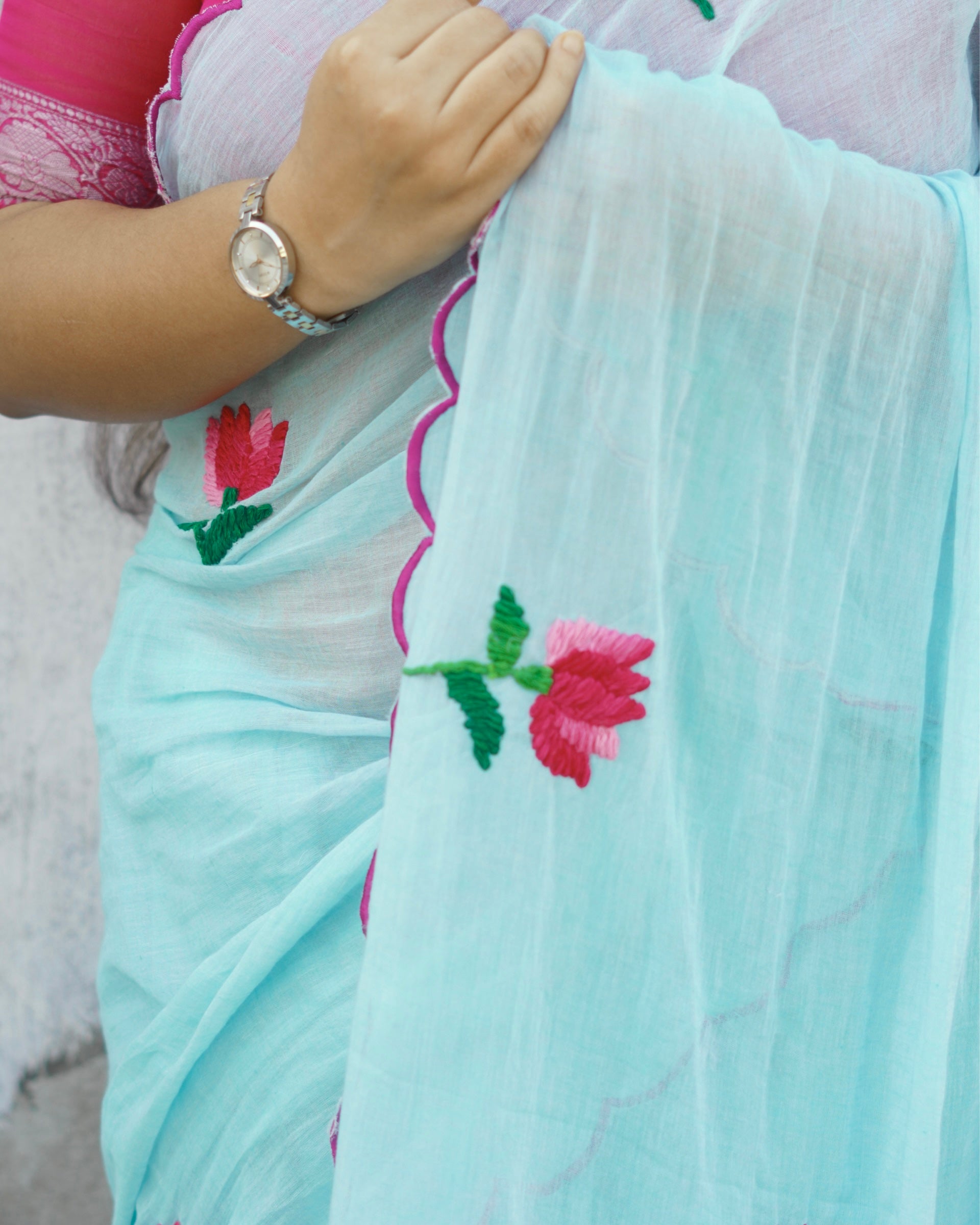 Lightweight cyan blue embroidered mulmul cotton saree, designed for soft comfort and effortless summer elegance.