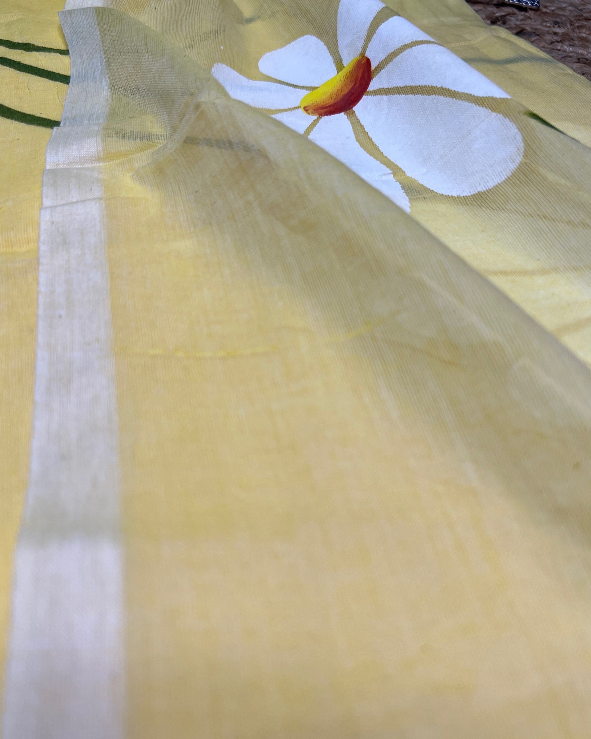 Soft and comfortable light weight lemon yellow mulmul cotton saree with floral hand painting good for day time wear