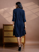 
Noir Fern black handwoven kala cotton, A-line dress, made sustainably in India.
