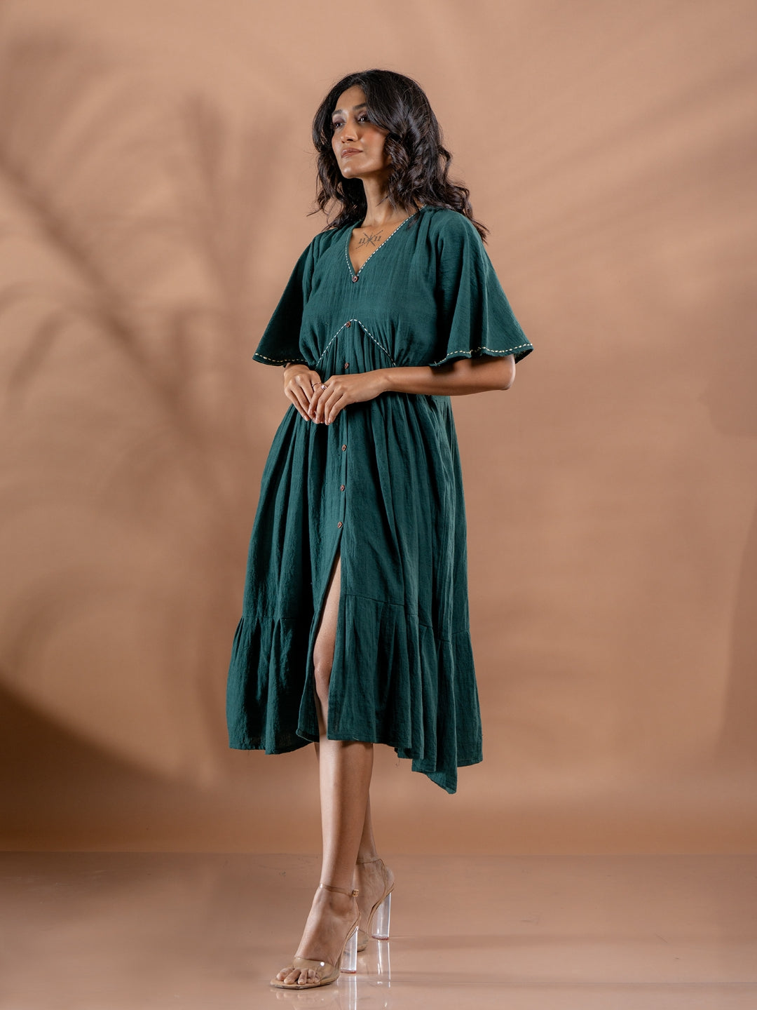 Ethically made ocean fern dress side view showcasing details of front slit and relaxed fit
