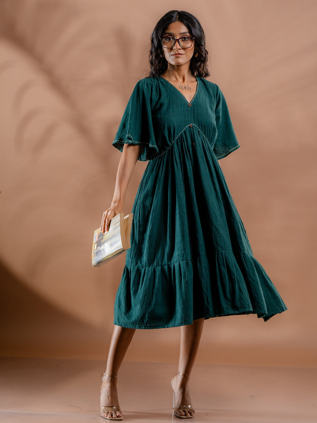 Model styling view of teal green kala cotton dress showcasing everyday casual look