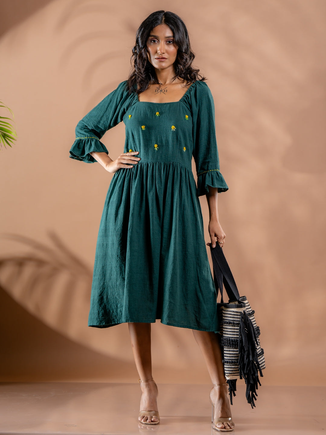 Model styling teal green summer cotton dress for women, for a chic casual day look Handwoven and hand embroidered.