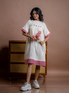 Women's off-white handwoven kala cotton tunic dress with pockets.