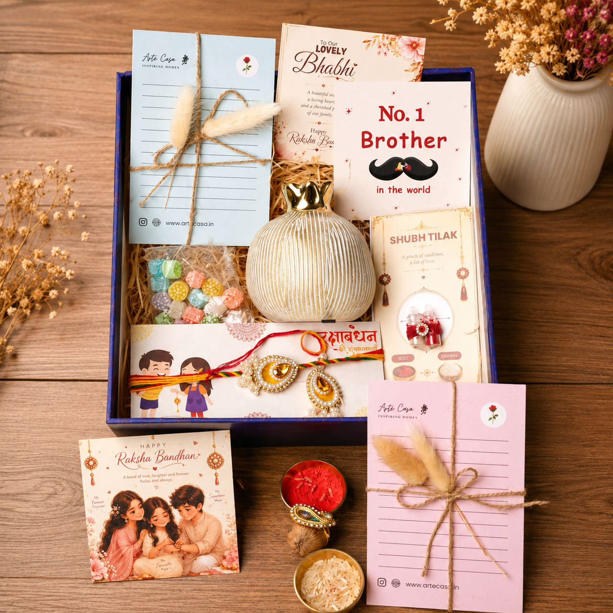 Artecasa Ivory Pomegranate Rakhi Gift Hamper for Bhai Bhabhi - https://artecasa.in/
