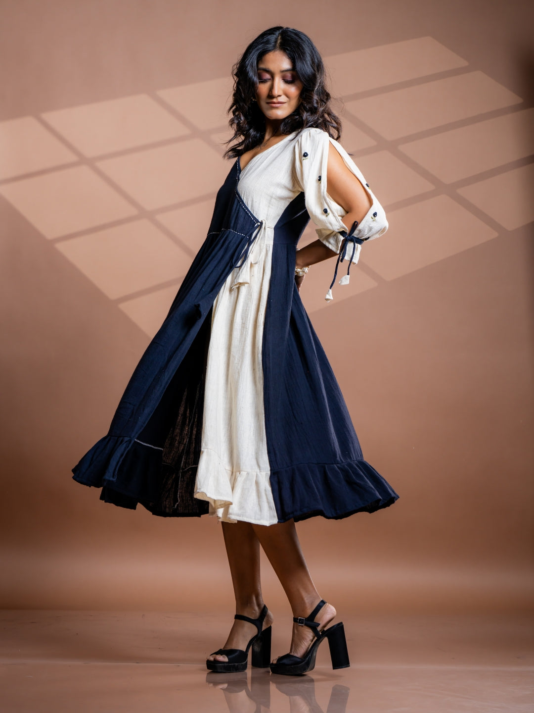 Side view of Selene kala cotton midi dress showcasing flattering silhouette, slit and sleeve details and utmost comfort of wearer
