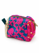 A compact, hand-embroidered mini pouch featuring vibrant pink threadwork on a rich teal base, accented with intricate detailing and a touch of gold. Perfect for carrying your everyday essentials, it adds a playful, festive touch to any look.