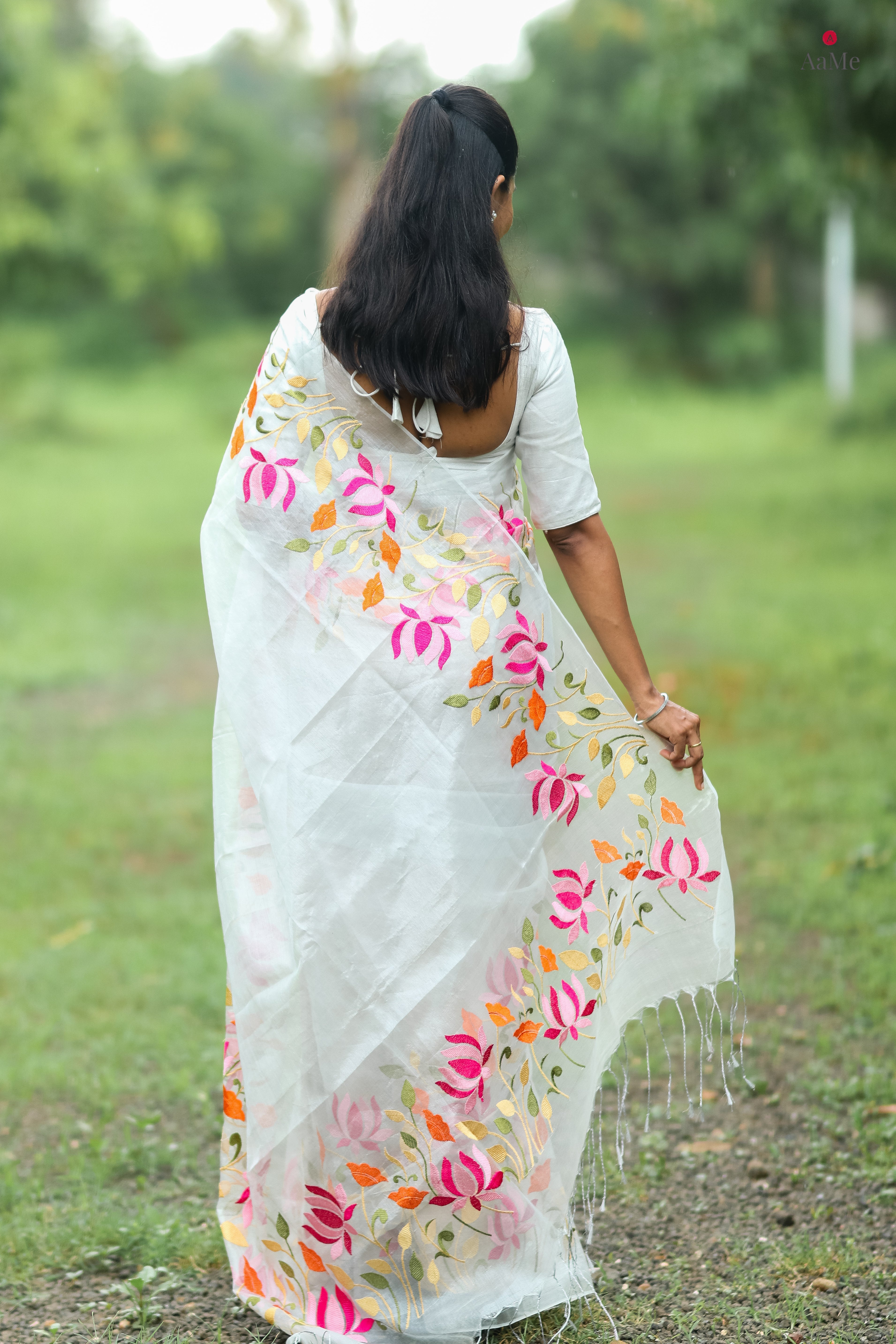 Silver white viral  tissue saree with floral embroidery orange and pink