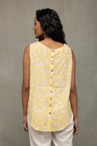 Back View of Sunshine Yellow Top Showcasing White Print and Buttoned Back Pattern