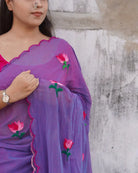 Lightweight mulmul cotton saree with lotus embroidery, designed for soft comfort and summer elegance.