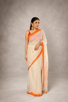 Floral weave detail of off-white and orange Jamdani saree